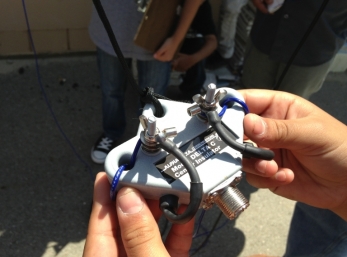 Once the rope was tied to the insulator, the antenna was ready to be hoisted up our mast.