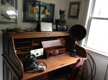 An antique desk and equipment just inside the door of W1AW.